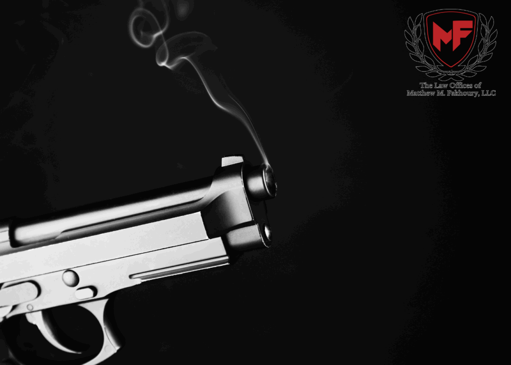 Smoking gun on a black background. Law Offices of Matthew M. Fakhoury logo is in upper right corner.